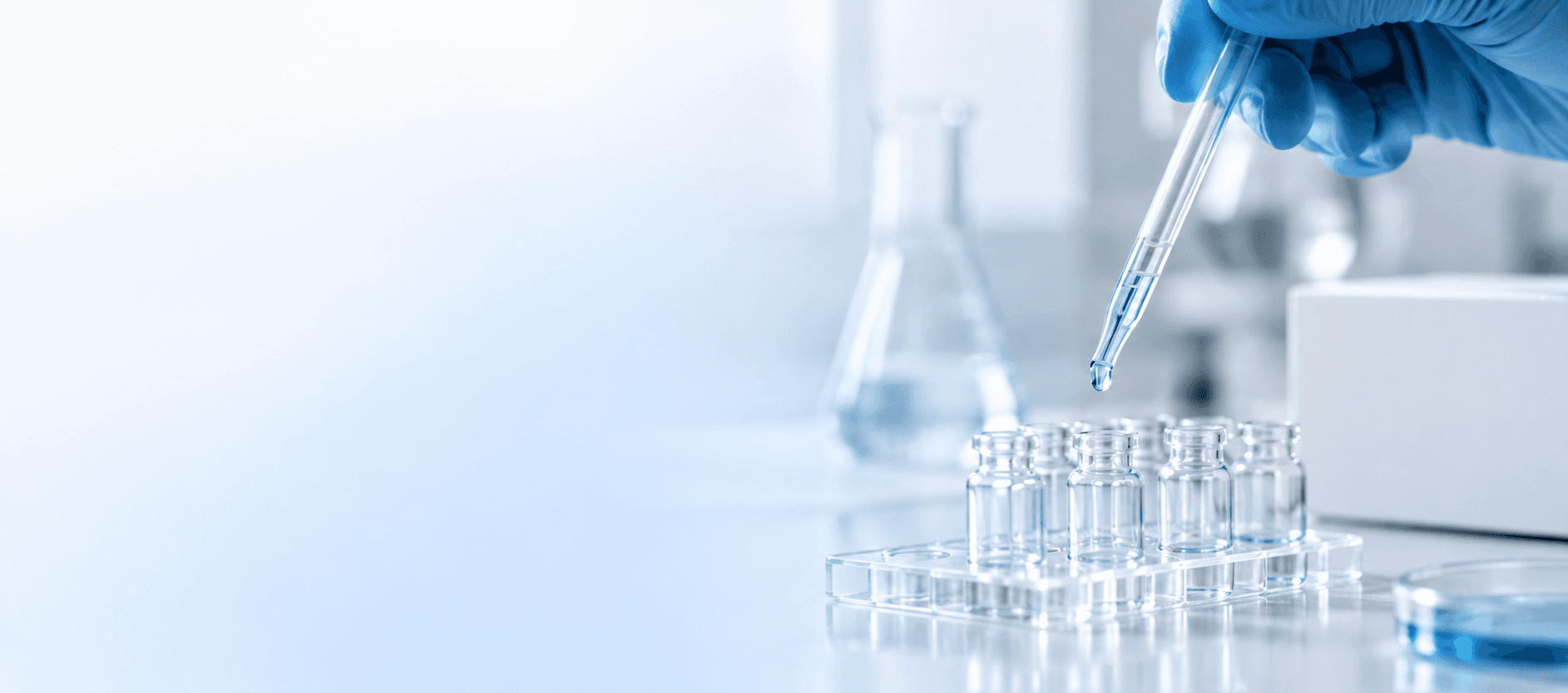 Lab technician preparing research samples with a pipette